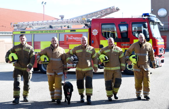 Six firefighters from the Peterhead Firestation Red Watch successfully completed a 75 mile walk from Peterhead to Dyce and back. Pictured are from left, Dean Peacock, Malcolm Cooper (with dog Buddy), Robbie Sturrock, Gary Collins and James Simpson.