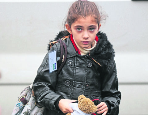 Syrian refugee families arrive at their new homes on the Isle of Bute.