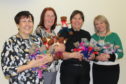 L-R: Democratic Services Manager, Moira Patrick; Committee Services Officer, Caroline Howie; Chief Inspector, Maggie Miller, and Committee Services Officer, Lissa Rowan with the trauma teddies