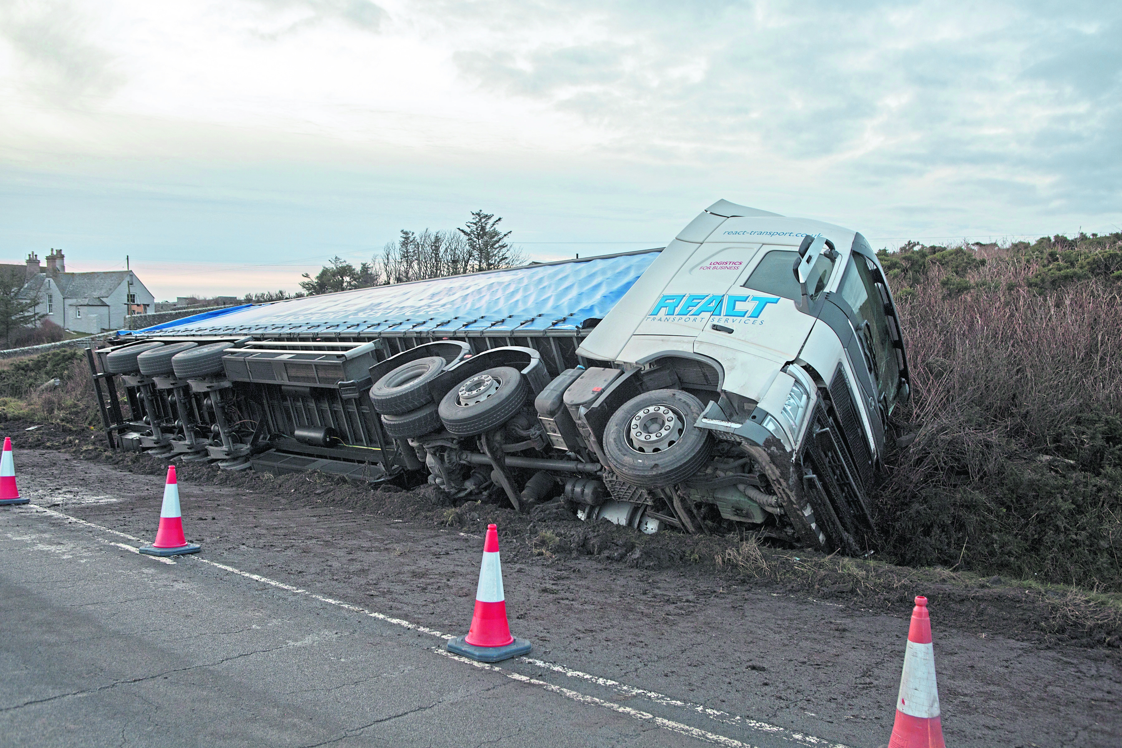 This artic lorry caught the verge, and overturned.