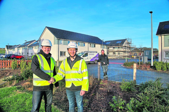 Pictured L-R at the Grainbank development on Orkney are Stephen Kemp of Orkney Builders; Craig Shearer, Openreach ops manager for Orkney; and, in the background, Dominic Dransfield, Openreachs newest recruit on Orkney.