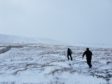 Hill walkers in soft snow on Glen Nevis at the weekend.