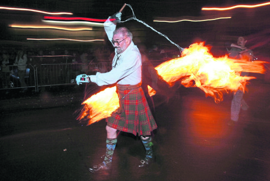 Revellers celebrate Hogmanay in Stonehaven.