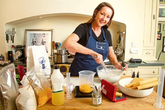 Michelle Porter making products in her kitchen.
