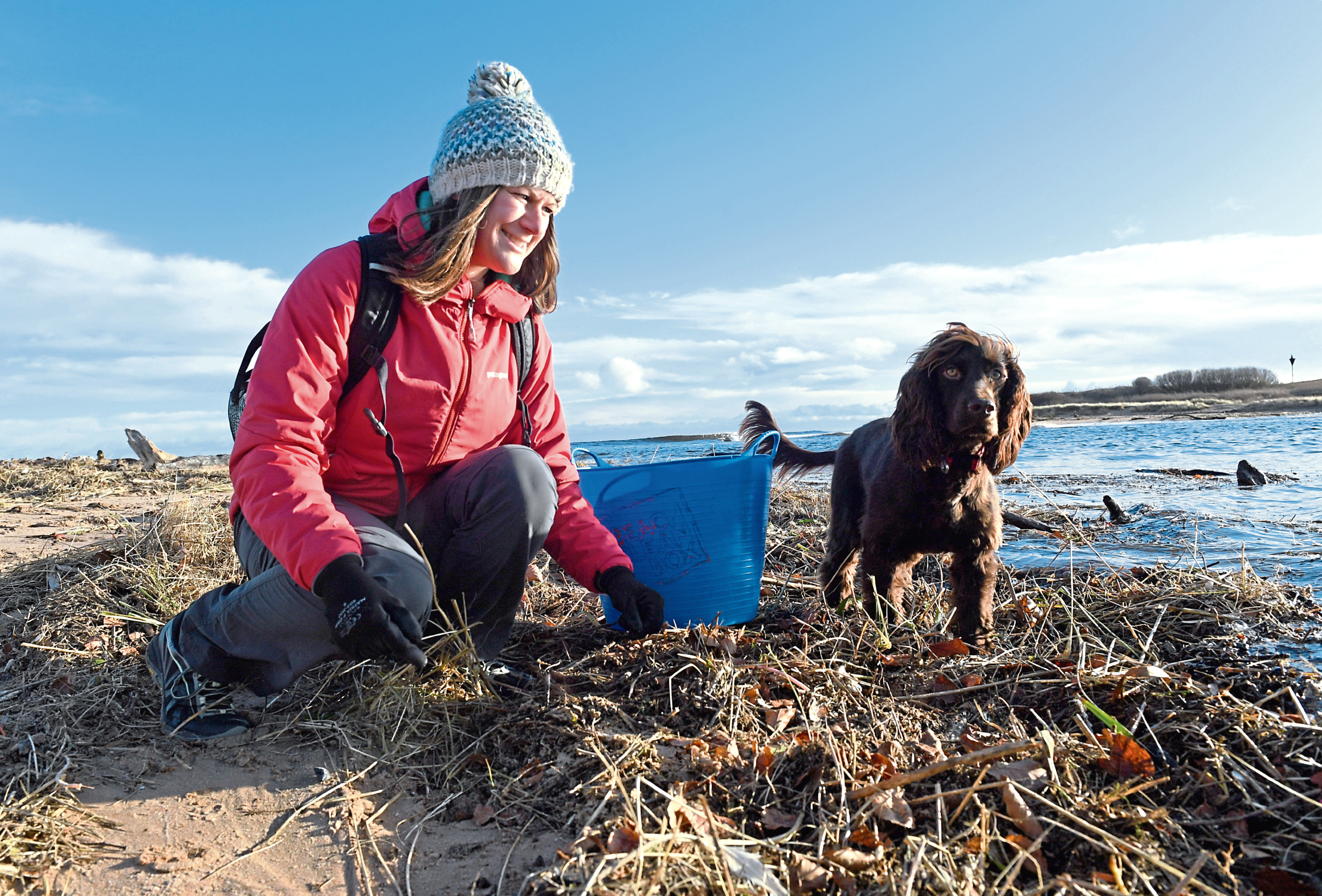 Lauren Smith, with her dog Tattie, on a beach clean.