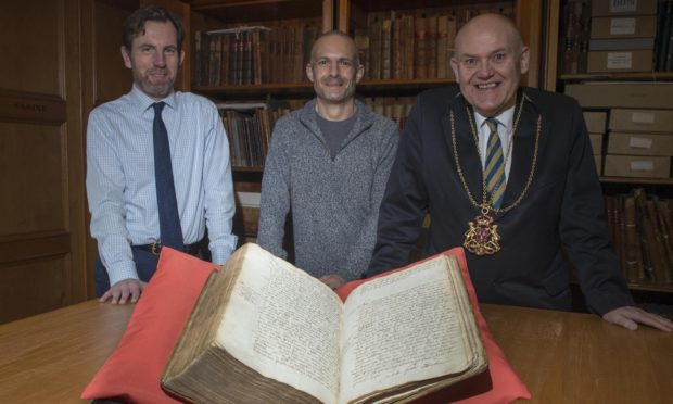 Picture left to right: Phil Astley (Archivist),Thomas Brochard, an Honorary Research Fellow at the University of Aberdeen, Lord Provost Barney Crockett