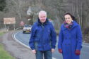 Campaigner Douglas Stewart and Kate Forbes MSP on the side of the A82.