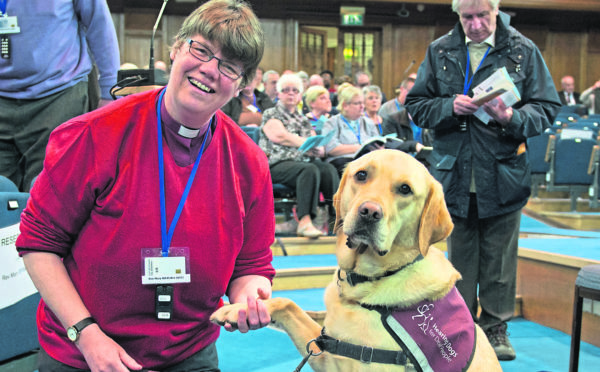 The Rev Mary Whittaker and her trusty companion, Scott the hearing dog, at the General Assembly of the Church of Scotland.