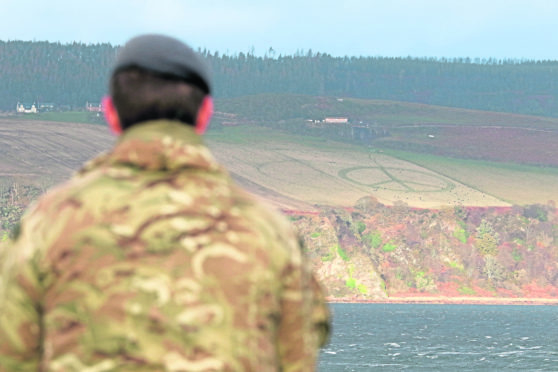 A large peace sign has been mowed in to a field overlooking the Fort George military barracks at Ardesier near Inverness.