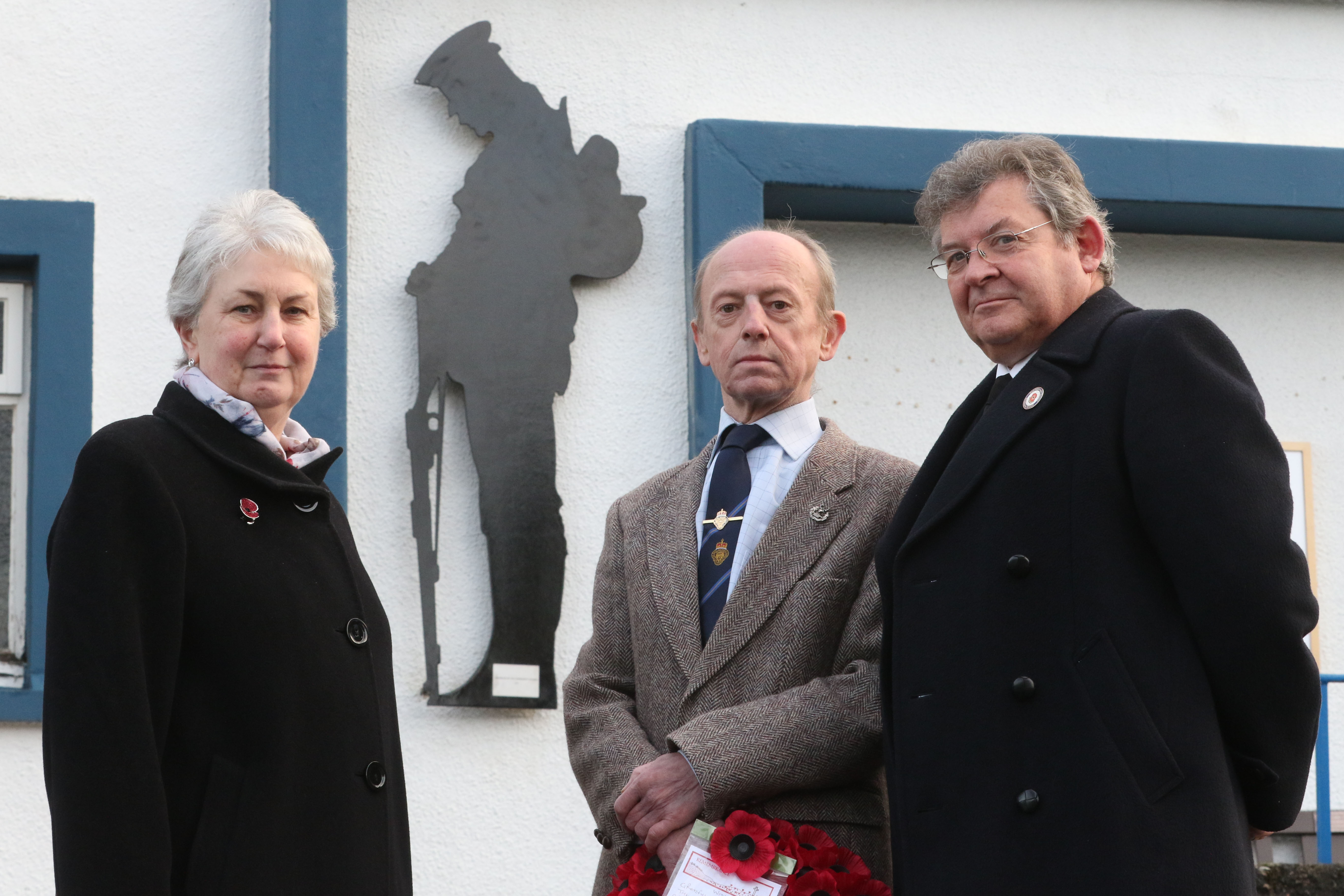 Linda Coe, chairwoman of Grantown and Vicinity Community Council, Roger Grant of the Grantown branch of the Royal British Legion and Ewan MacGregor, also of the community council, next to the Silent Soldier Silhouette.