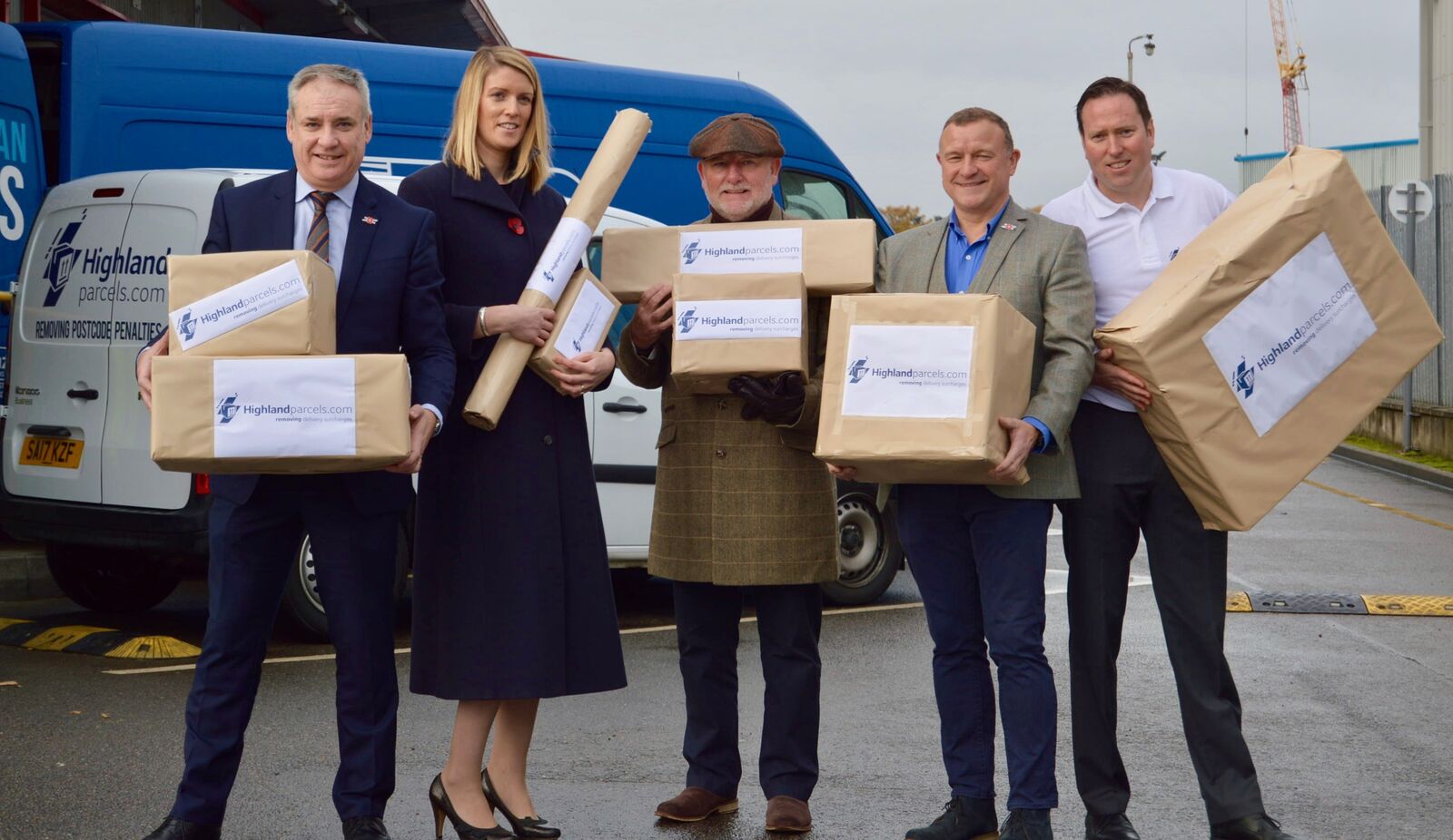 Richard Lochhead MSP, Fishbox director Fiona Houston, businessman Willie Cameron, Drew Hendry MP and Menzies Distribution general manager Fraser MacLean at the launch of the Highland Parcels delivery service.