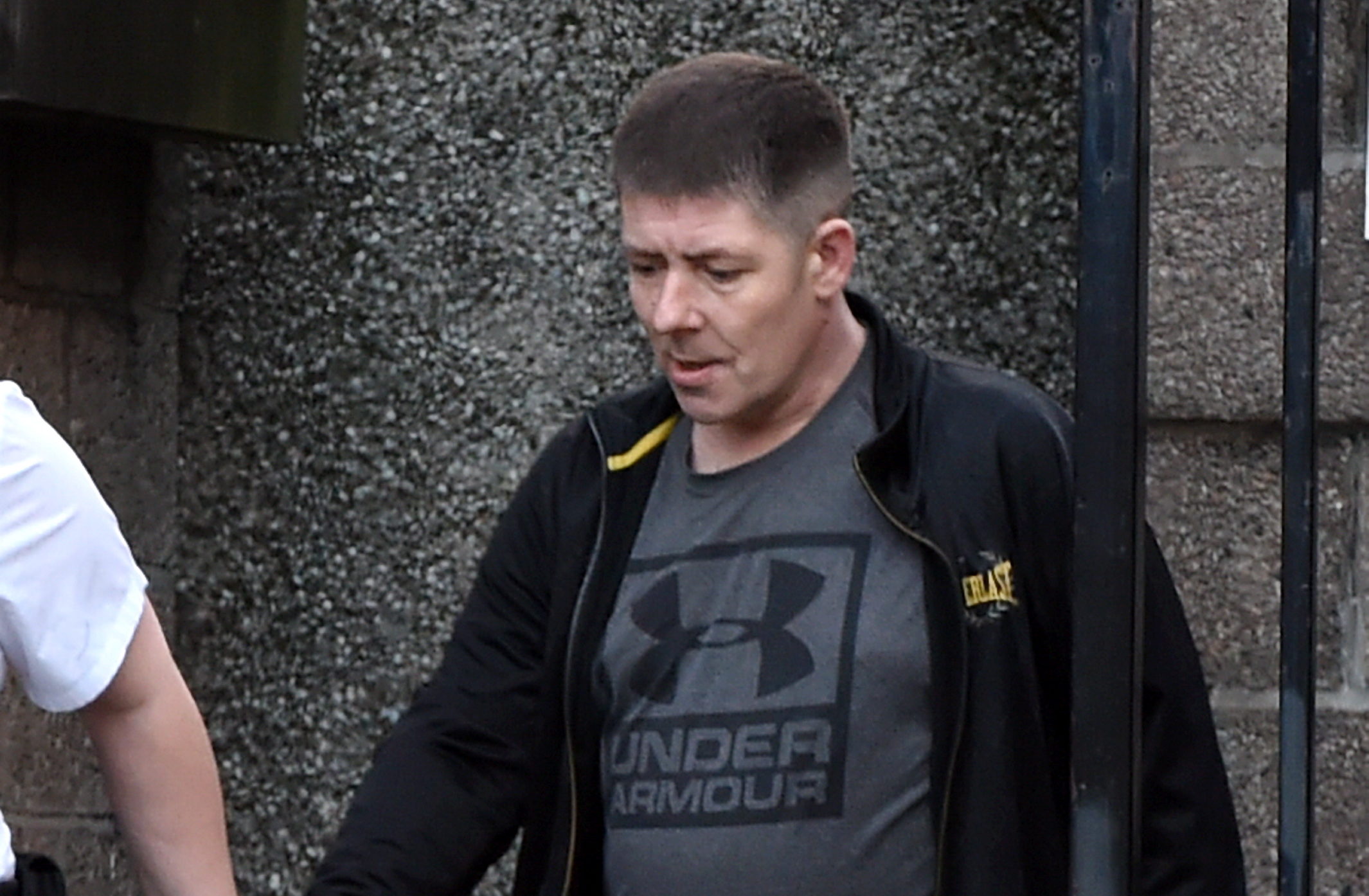 John Thomas Gordon Hildreth in custody whilst leaving Aberdeen Sheriff Court.