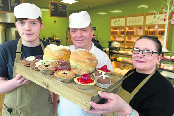 Aaron, Paddy and Jane Murphy in their Harbour Road Premises with some of their products.