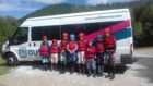 A group of Outfit Moray participants prepare for a kayaking adventure.