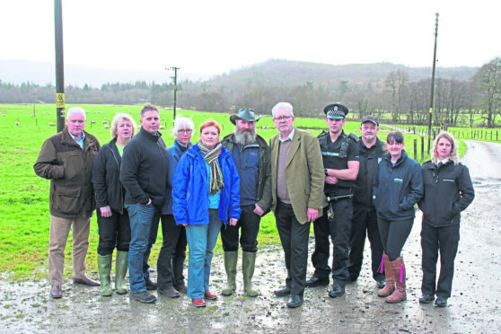 Farmer Brian Walker, with MSPs Mike Russell and Emma Harper and others involved in the meeting yesterday including police and SSPCA officers.