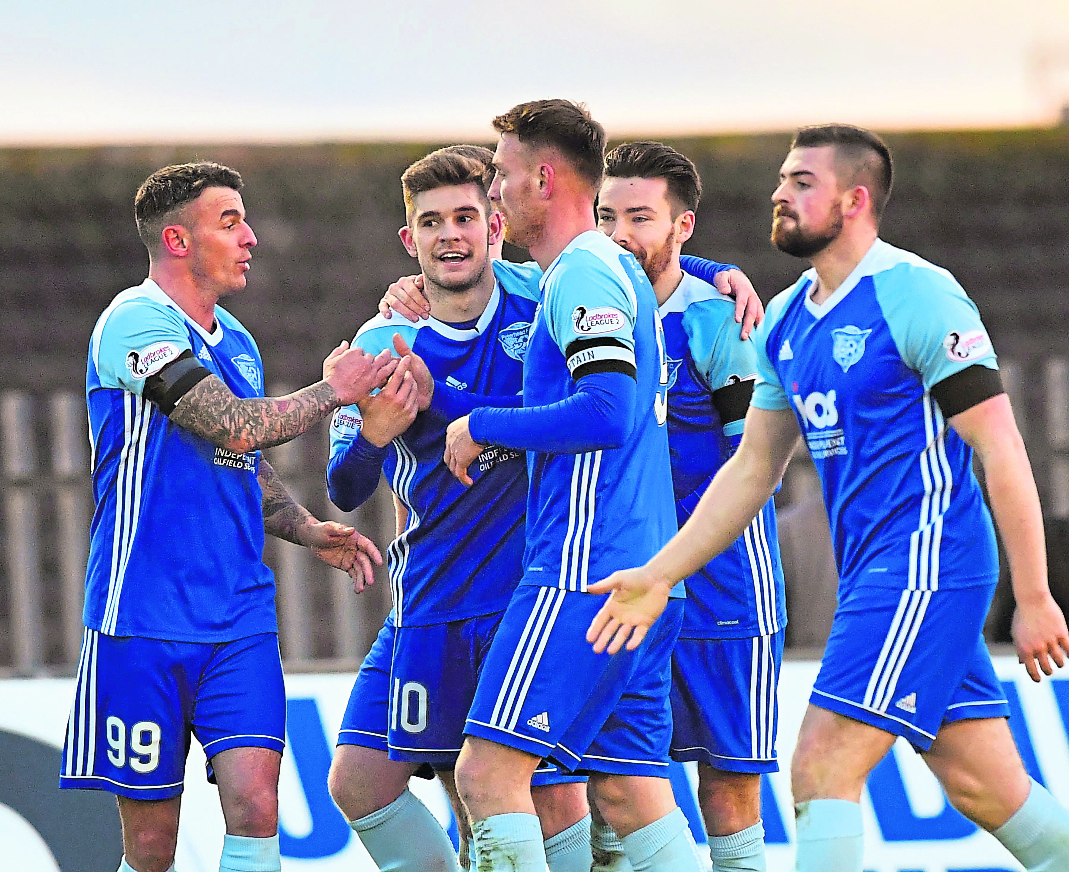 Jack Leitch is congratulated by team-mates after giving Peterhead the lead in what proved to be a ‘good win’ over Stirling Albion