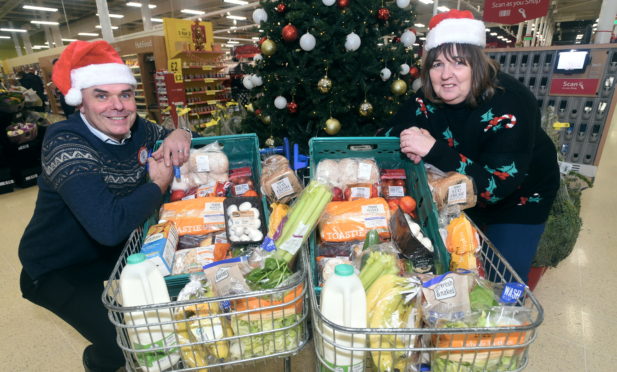 Councillor Geva Blackett has organised three free festive lunches in Deeside.