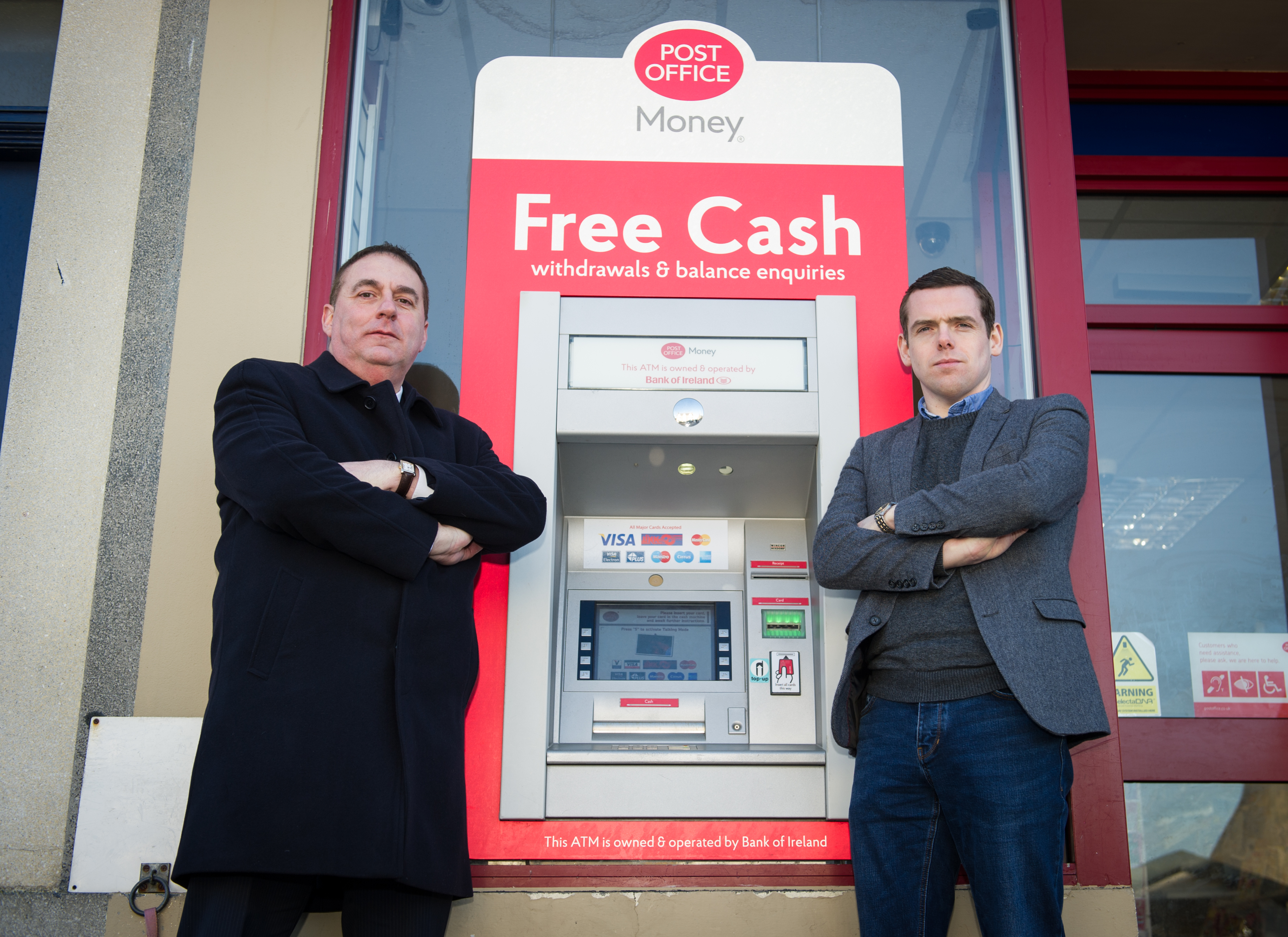 Heldon and Laich councillor James Alland and Moray MP Douglas Ross outside the Post Office ATM in Lossiemouth.