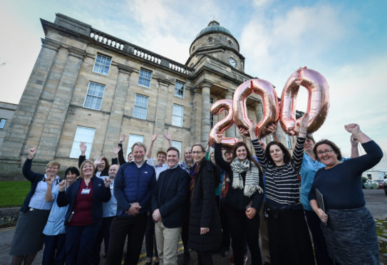 Management and staff are pictured outside Dr. Gray's hospital in Elgin to commemorate its 200th anniversary. Photograph by Jason Hedges.