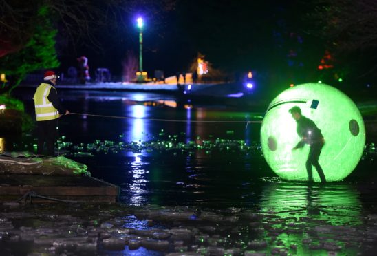 The boating lake lit up during the Winter Wonderland at Whin Park, in Inverness. Photograph by Sandy McCook