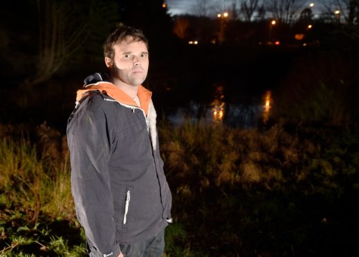 Willie Russel, 35, at the scene of the crash.