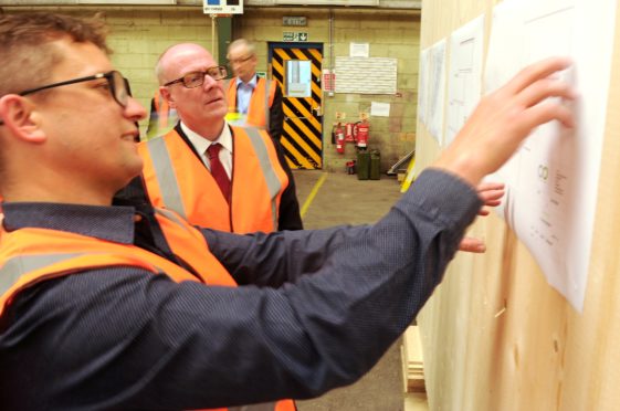 Local Government and Housing Minister Kevin Stewart and Fit Home project partners touring Carbon Dynamic factory and viewing Fit Homes currently in development at the Invergordon site.