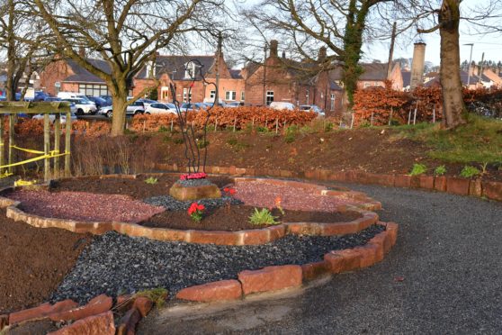The memorial garden at Turriff cemetery where plants and flowers have been removed.