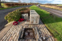 This is a picture from the scene of the WW11 RAF Banff Strike Wing Memorial at Boyndie, between Portsoy and Banff on a lay by at the A98 in Aberdeenshire, Scotland. The Monument has been hit by a vehicle at speed, knocking it from iots mounting and making t turn in 90 deg. It would appear to have been hit by a Red coloured vehicle. Photographed by JASPERIMAGE ©.