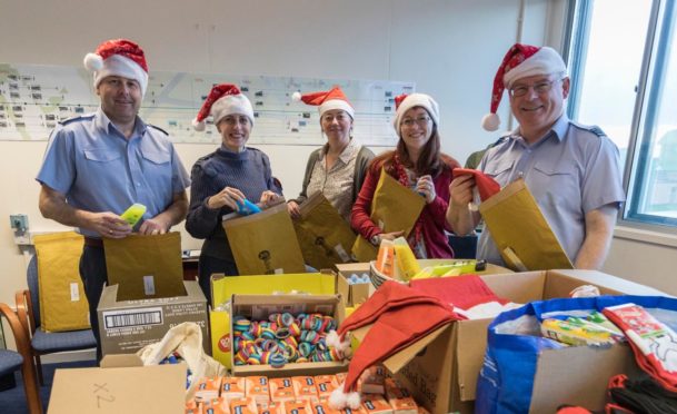 Personnel at RAF Lossiemouth assemble the parcels.