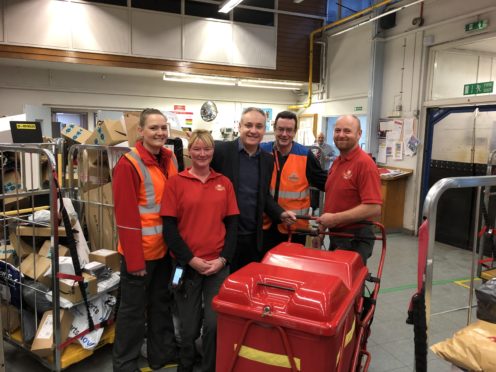 Richard Lochhead with Royal Mail employees in Elgin