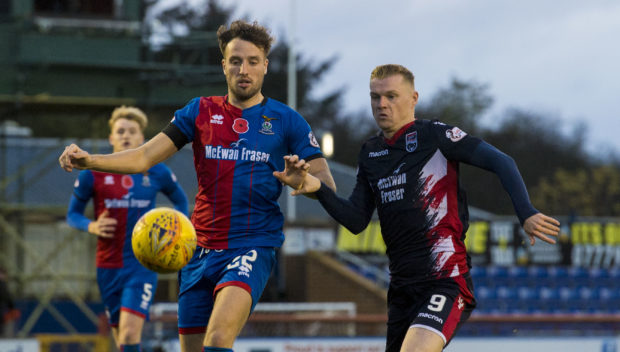 Inverness' Brad McKay (left) battles with Ross County's Billy McKay