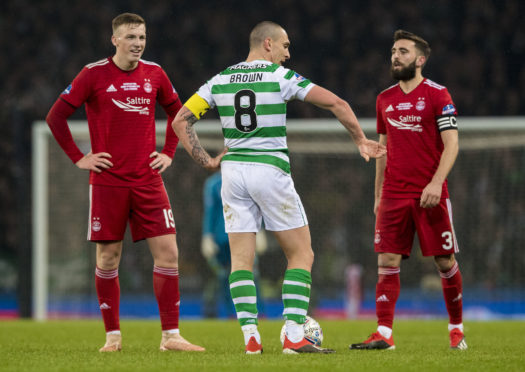 Graeme Shinnie and Lewis Ferguson with Celtic skipper Scott Brown.