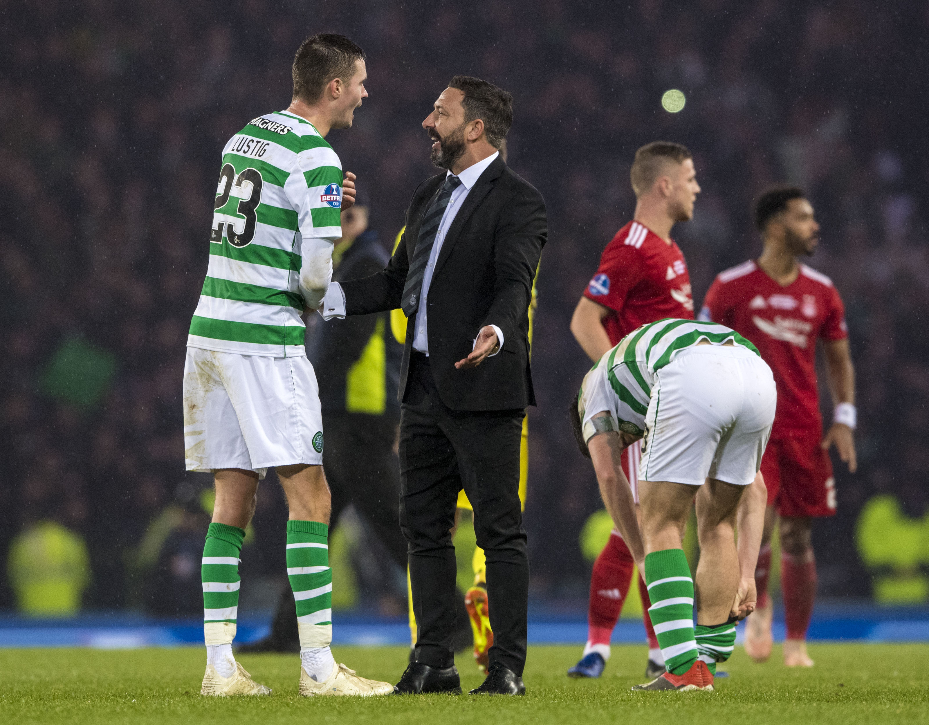 Aberdeen manager Derek McInnes speaks with Celtic's Mikael Lustig after the Betfred Cup final.