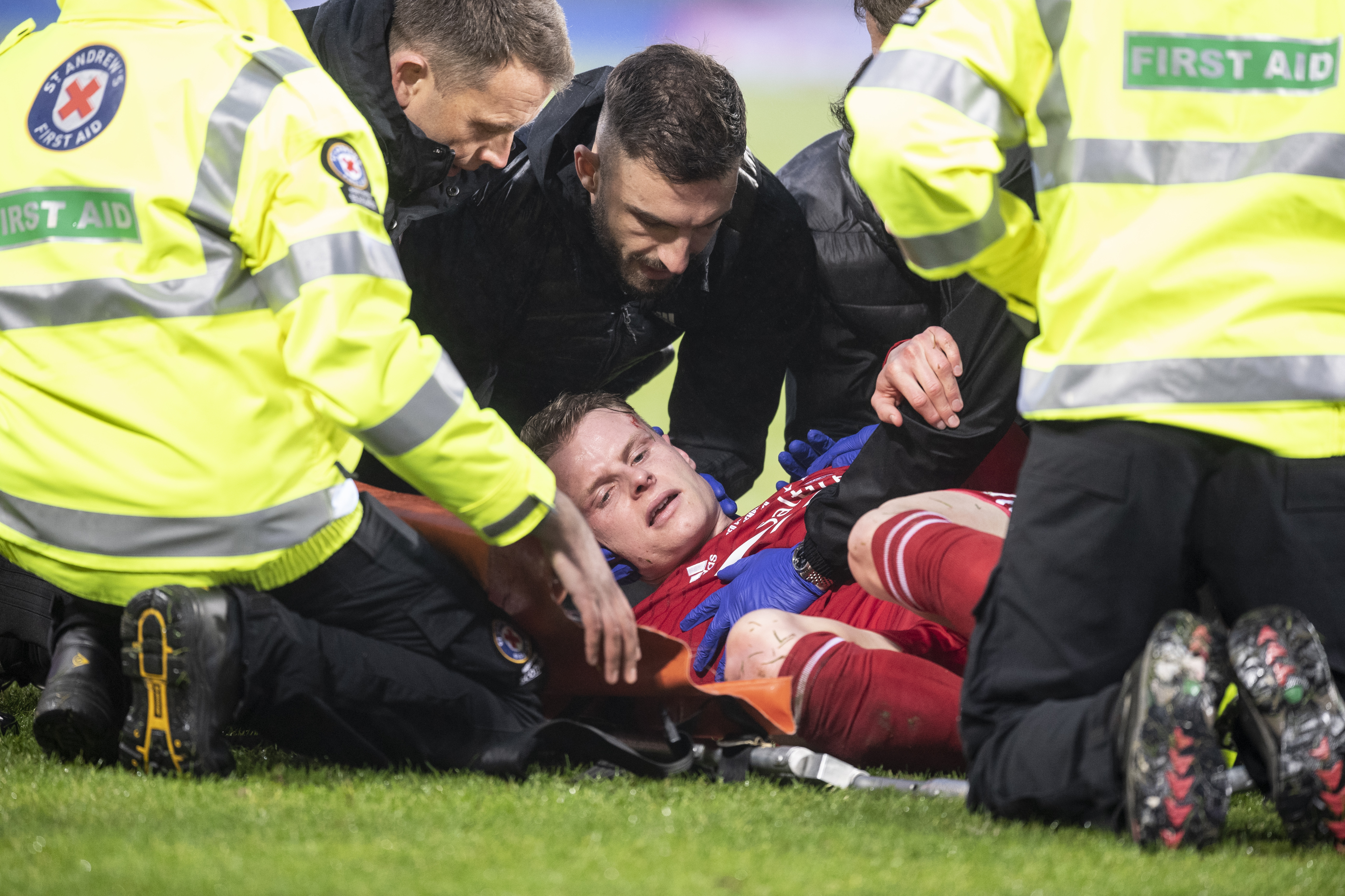 Gary Mackay-Steven receives treatment after suffering a nasty head injury
