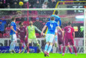 St Johnstone's Joe Shaughnessy rises highest to header the visitors ahead.