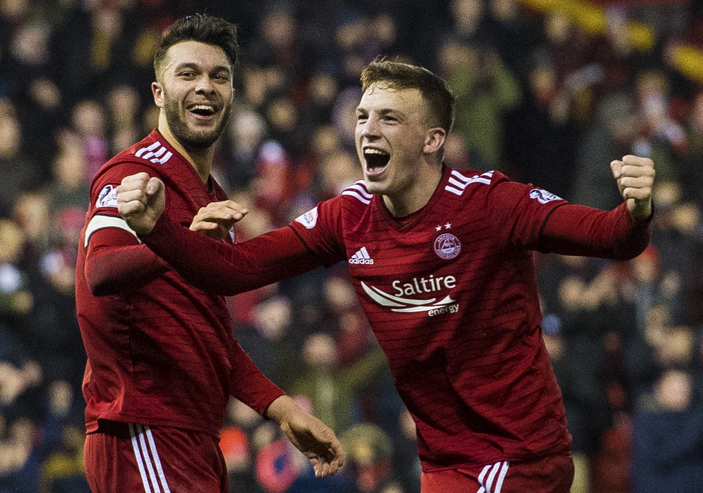 Connor McLennan and Lewis Ferguson celebrate after the latter's winner against Livingston.