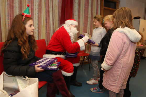 Santa had a gift for every child in Kiltarlity on Saturday