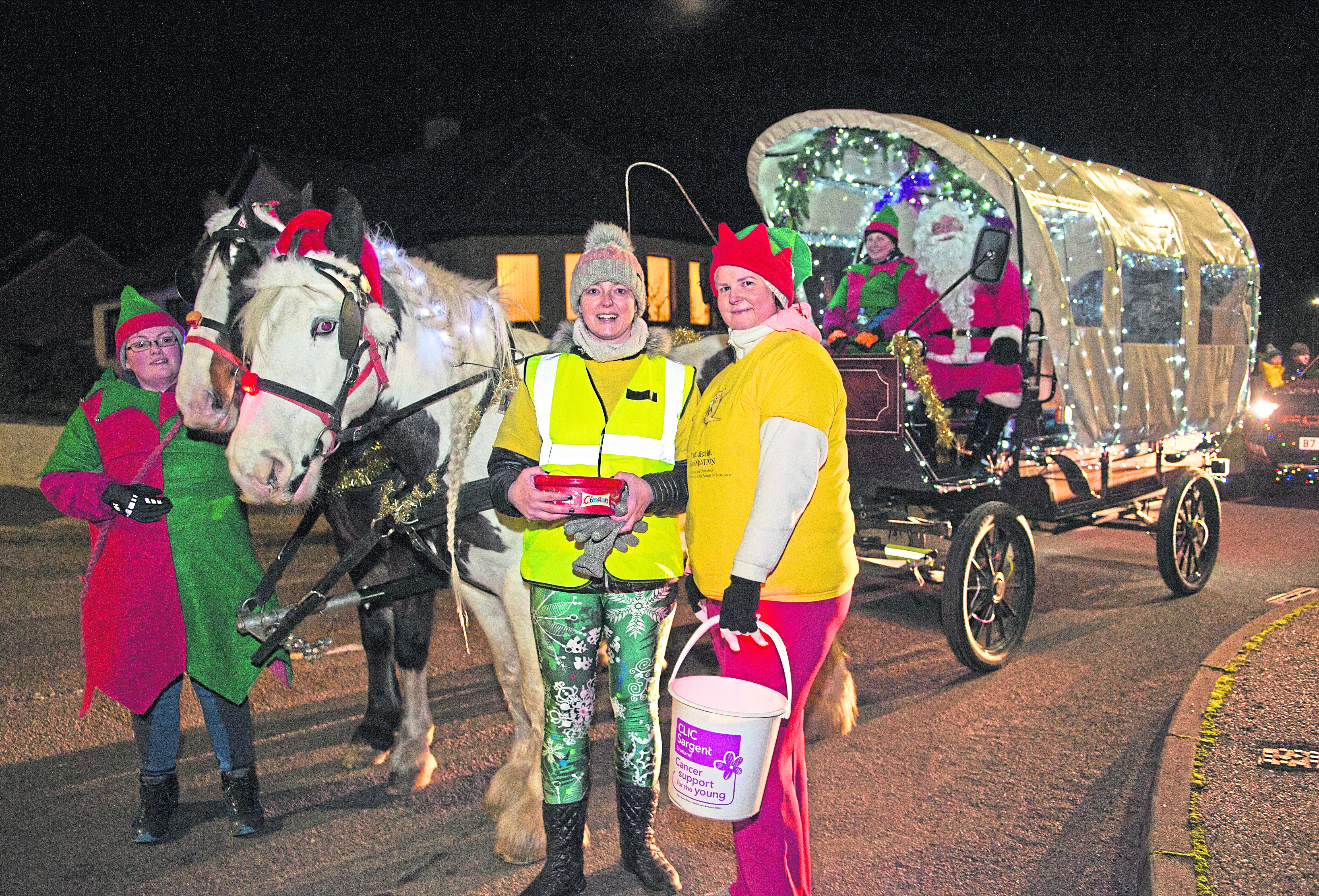 Yvonne Milton (left) and Janice Gregor (right) from 'Santa on the streets' are pictured in Elgin pounding the streets raising money for charity.