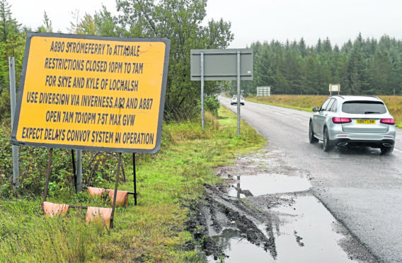 Roadworks for stabilising rock and installing netting above the A890 between Stromferry and Attadale.   Signage at the end of the road close to Lochcarron warning drivers of delays and restrictions.