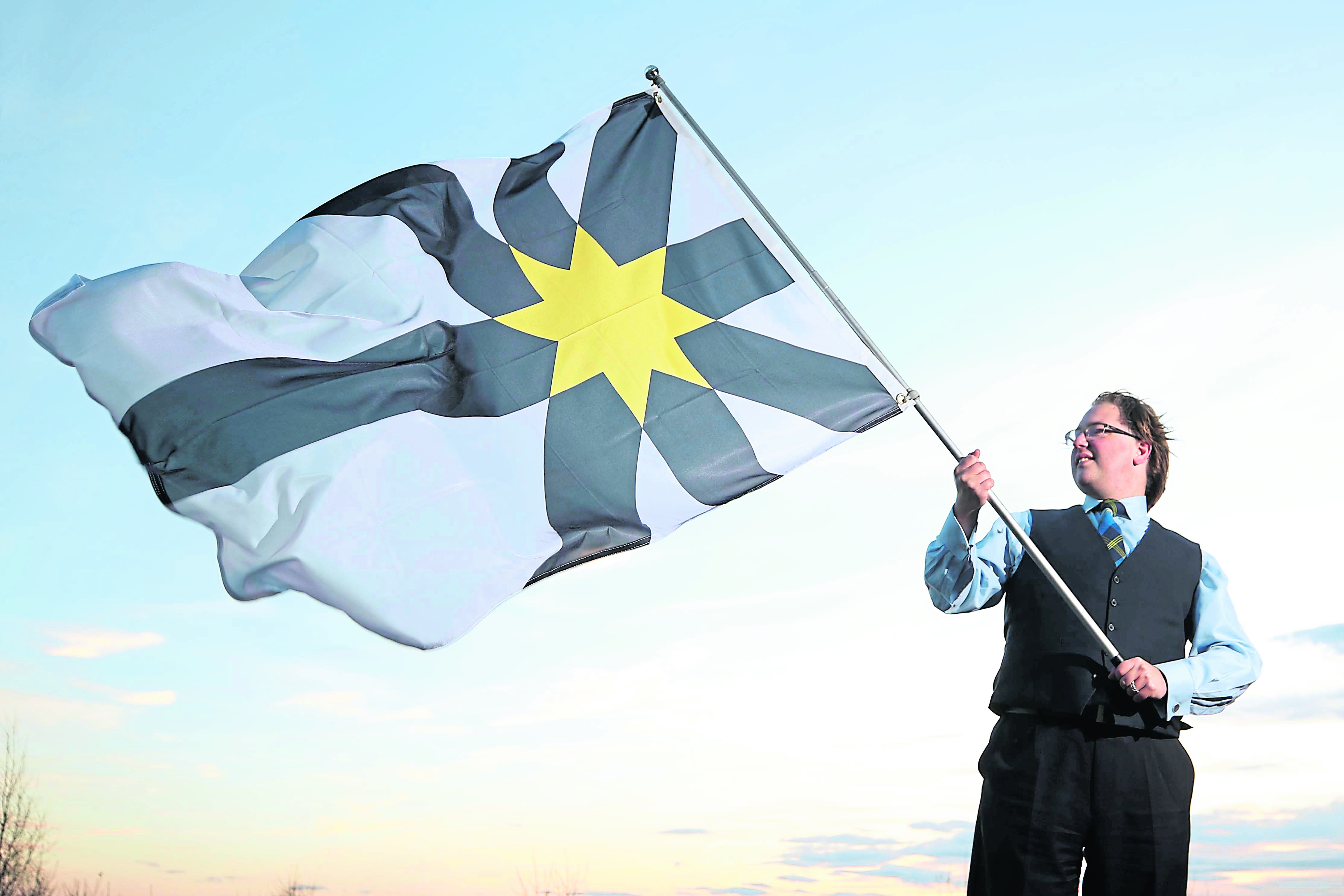 The new flag for Sutherland was unveiled at the Council offices in Golspie by Philip Tibbetts, the "Honorary Vexillologist at the Court of the Lord Lyon".