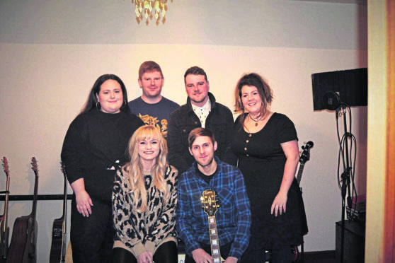 Band members (Back row l-r)  Rachel Bruce, Stew Cardno, Jamie Mathers, Anneka Niro. Front is Emma Salmond and Graemie-John Watt.