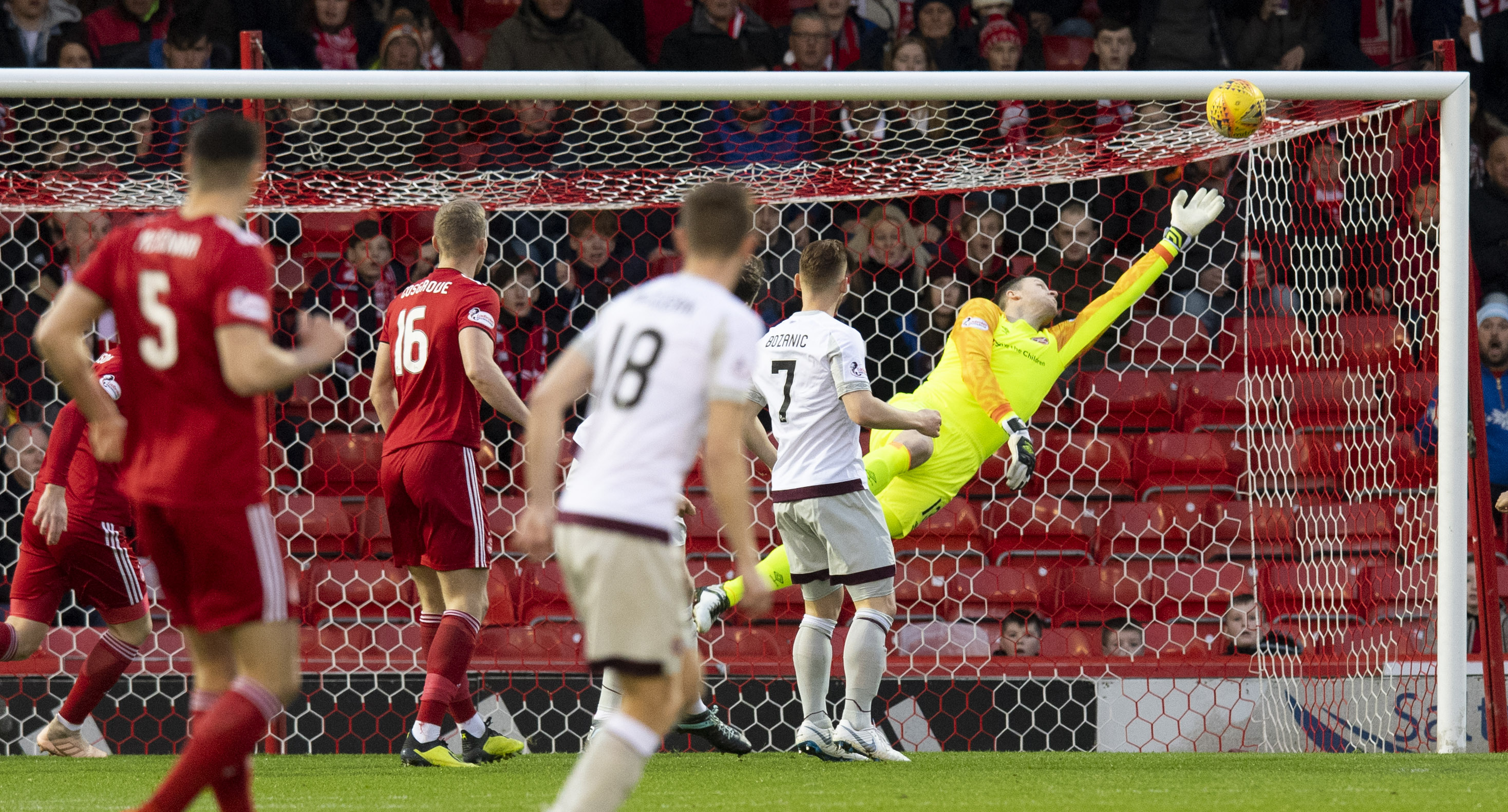Aberdeen striker Sam Cosgrove scores past Hearts goalkeeper Colin Doyle to make it 1-0.
