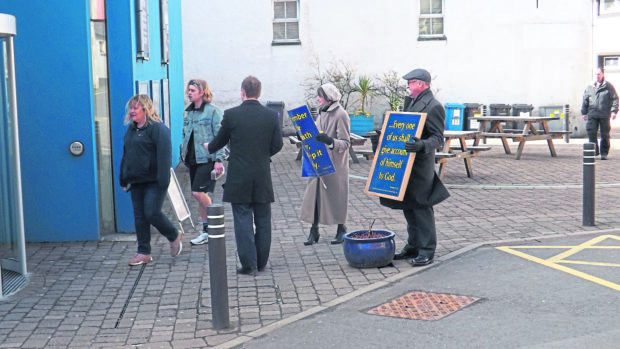 'Down with this sort of thing!' Protesters greeted cinema-goers at Stornoway on the Isle of Lewis today for a Sunday showing of the film Black Panther.