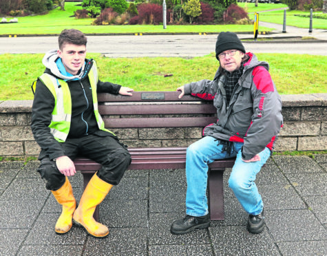 James Emslie (left) from Gaelforce Fusion with David Hobbs and the repaired bench in its new position on the esplanade.