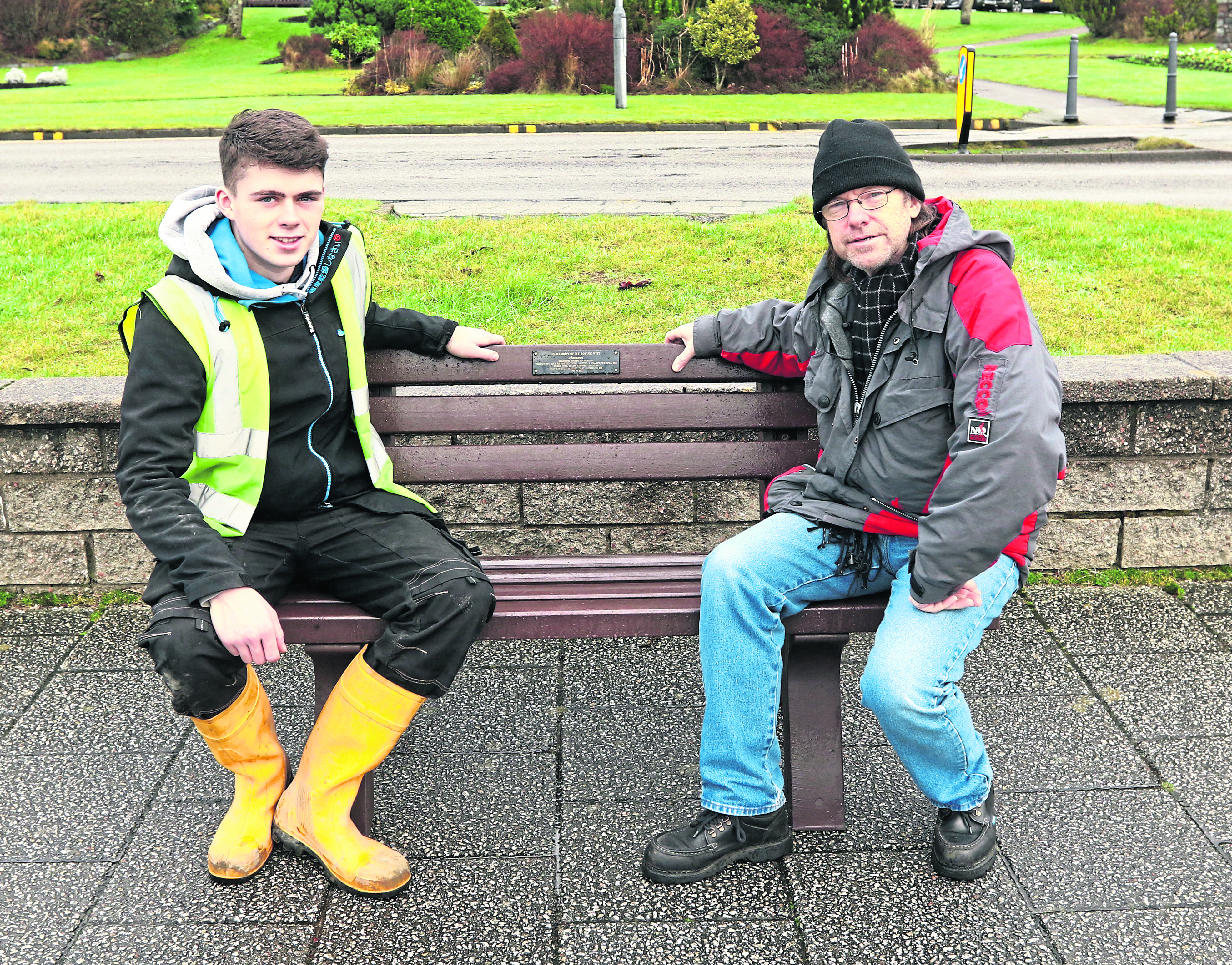 James Emslie (left) from Gaelforce Fusion with David Hobbs and the repaired bench in its new position on the esplanade.