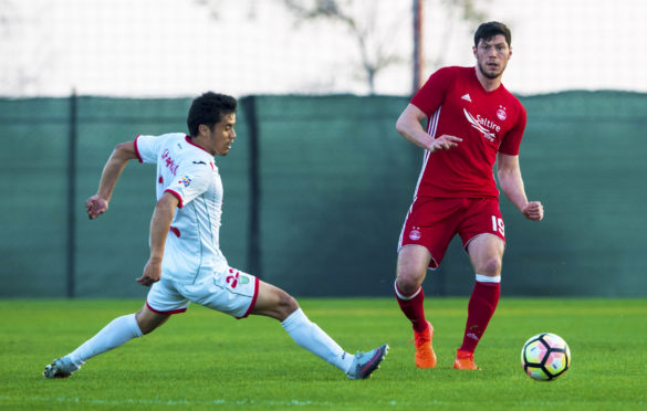 Aberdeen's Scott McKenna  in action in last year's friendly against Lokomotiv Tashkent..