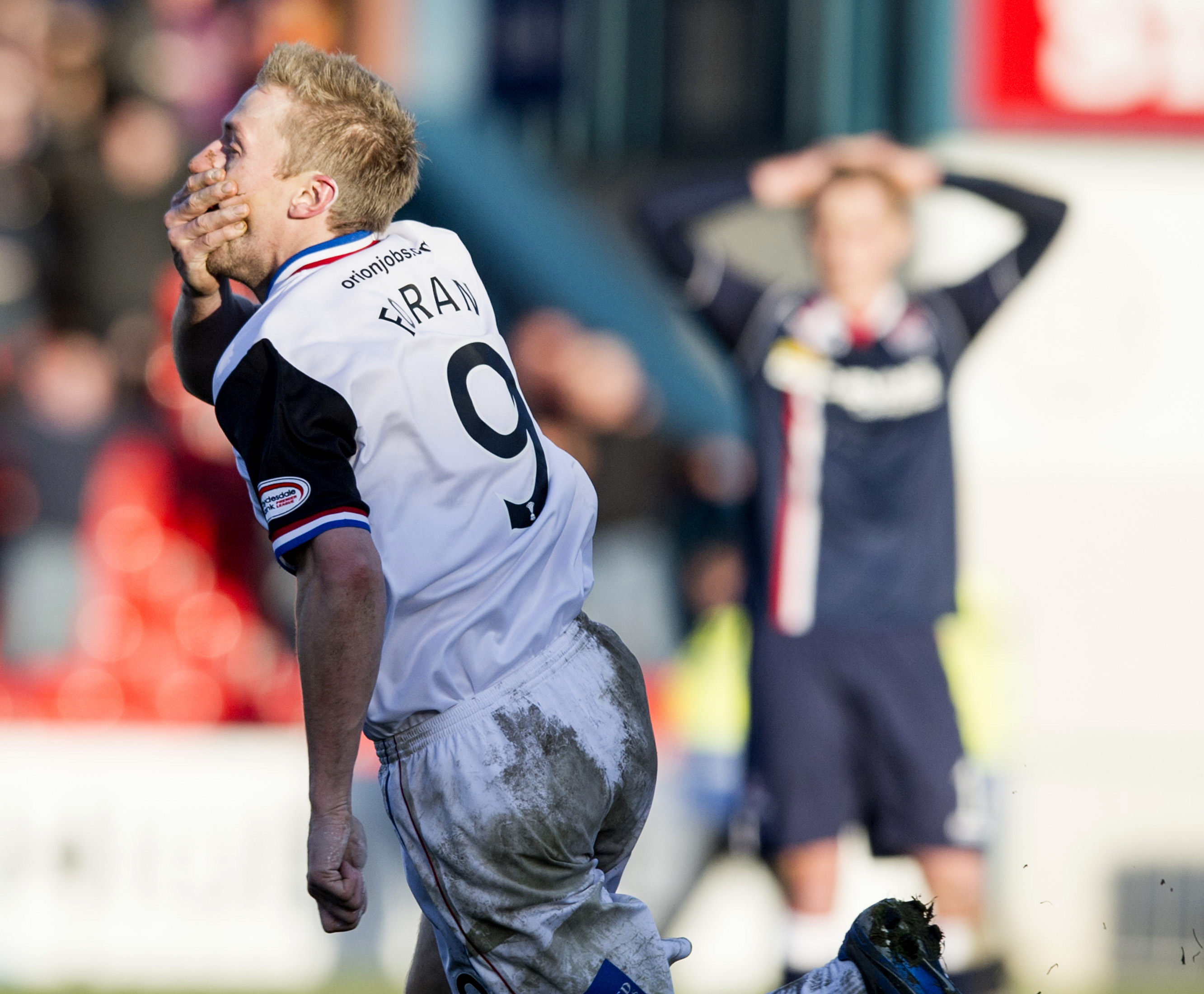 ICT's Richie Foran clutches his face in celebration of his goal scored with the same part of his body.