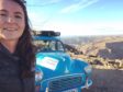 Laura Morrison with her blue Morris Minor at Fish River Cayon in Namibia.