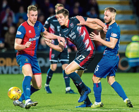 Caley Thistle's Sean Welsh (right) battles with Ross County's Ross Stewart.