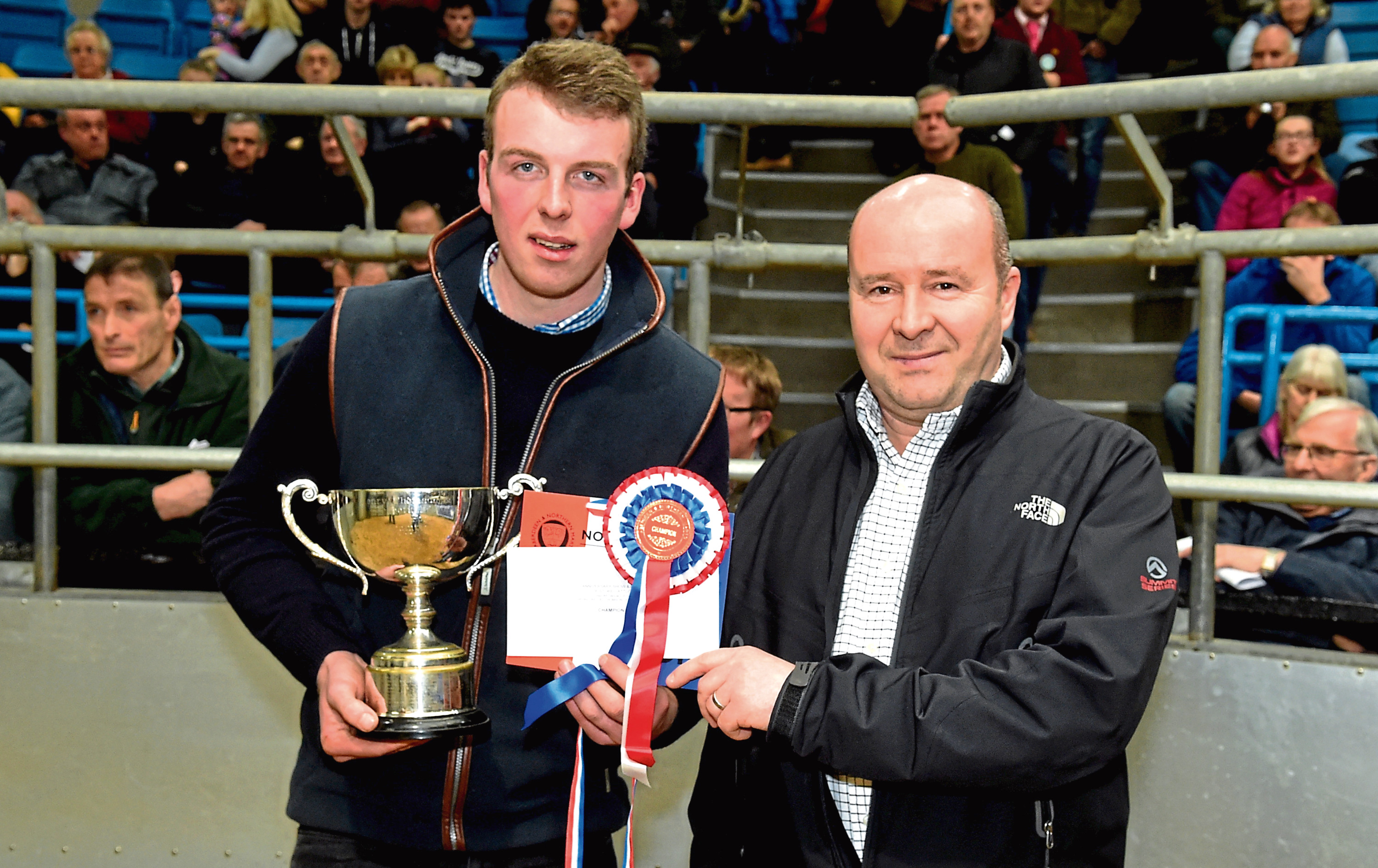 William Moir collects the overall champion trophy from show sponsor Eric Thomson.